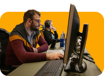 two men using computers in computer lab