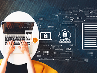 hands on keyboard next to computer icons floating